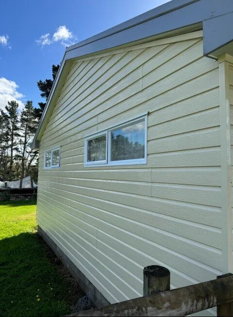 Weatherboard wall, green mould removed: after