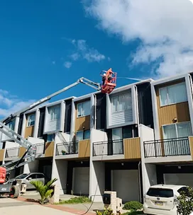Townhouse complex washed from an elevated work platform