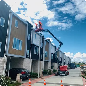 Crew washing a townhouse block
