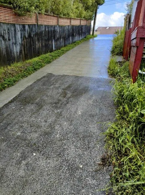 Sloped concrete path being washed
