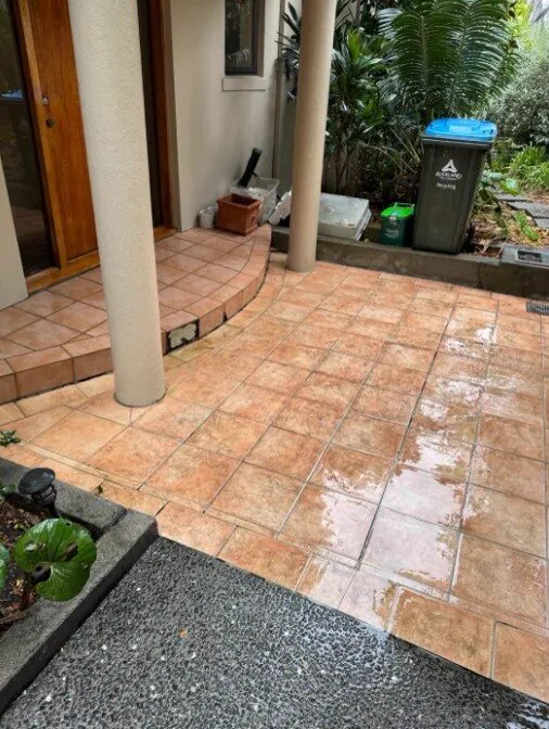 Tiled entry patio being washed