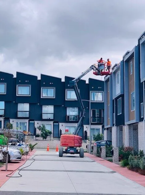 Elevated work platform on a townhouse street